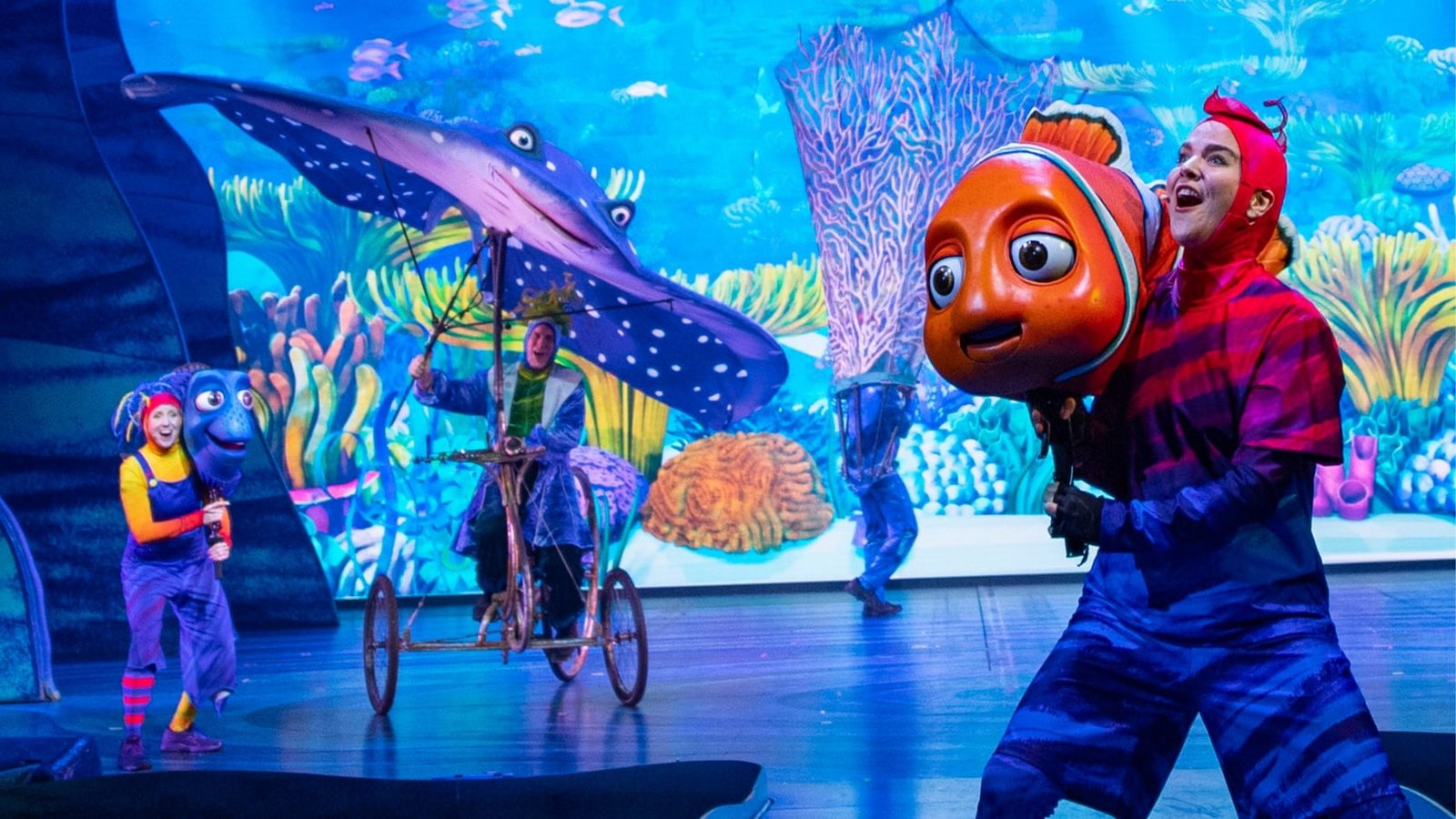 Cast members on stage use puppets during Finding Nemo The Big Blue and Beyond show in DinoLand USA at Disney's Animal Kingdom theme park